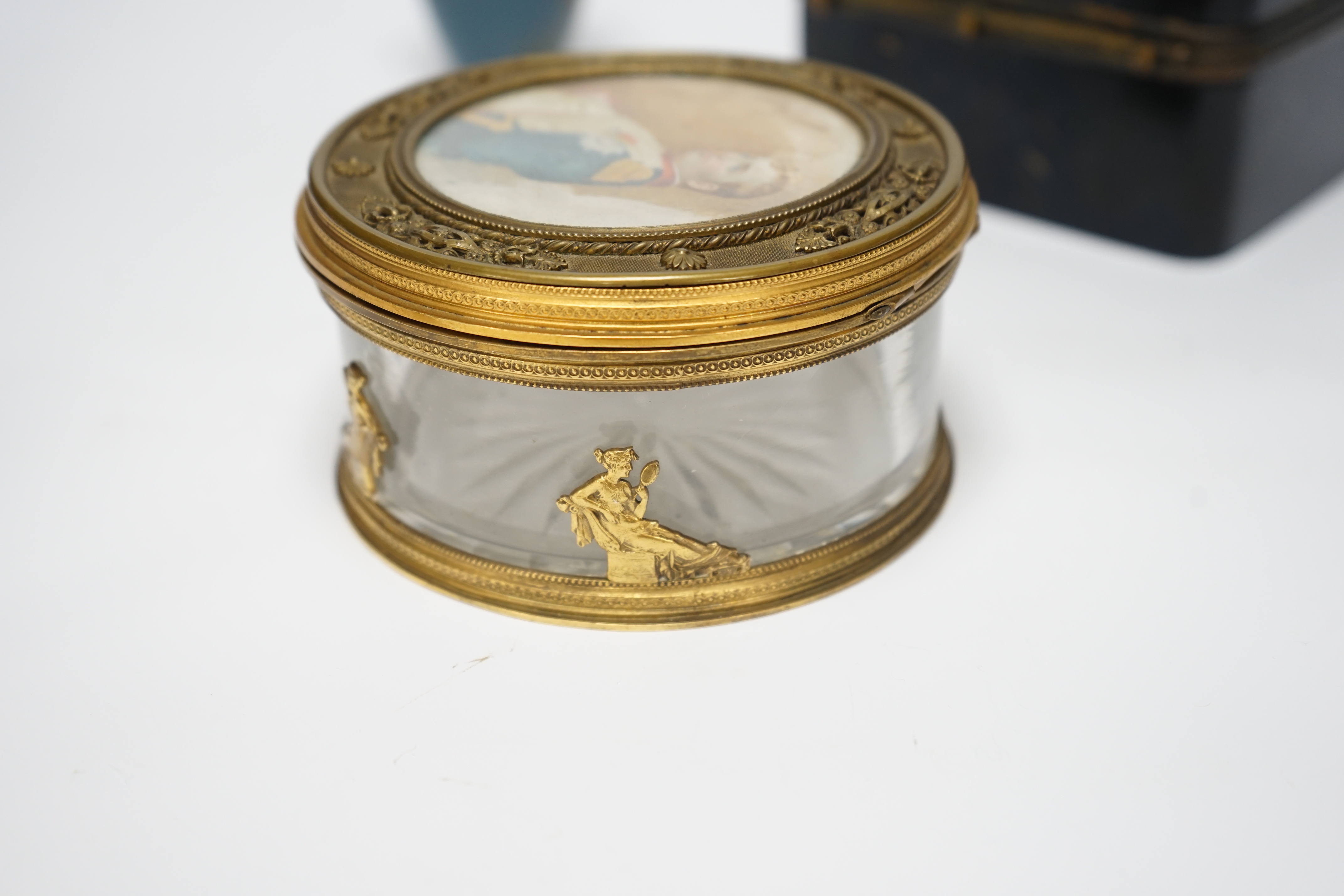 A Palais Royale circular gilt metal cut glass box with an inset portrait miniature of Napoleon on ivorine, 12cm diameter, a Bohemian enamelled glass box attributed to Moser, 12.5cm wide, a Japanese cloisonné enamel vase